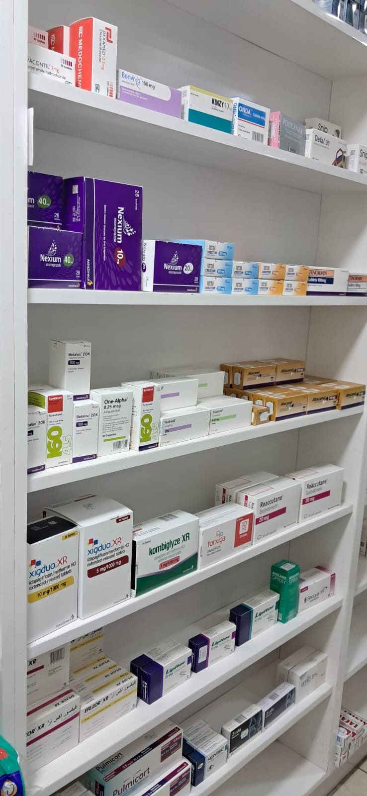 Medicine shelves with assorted packaged treatments
