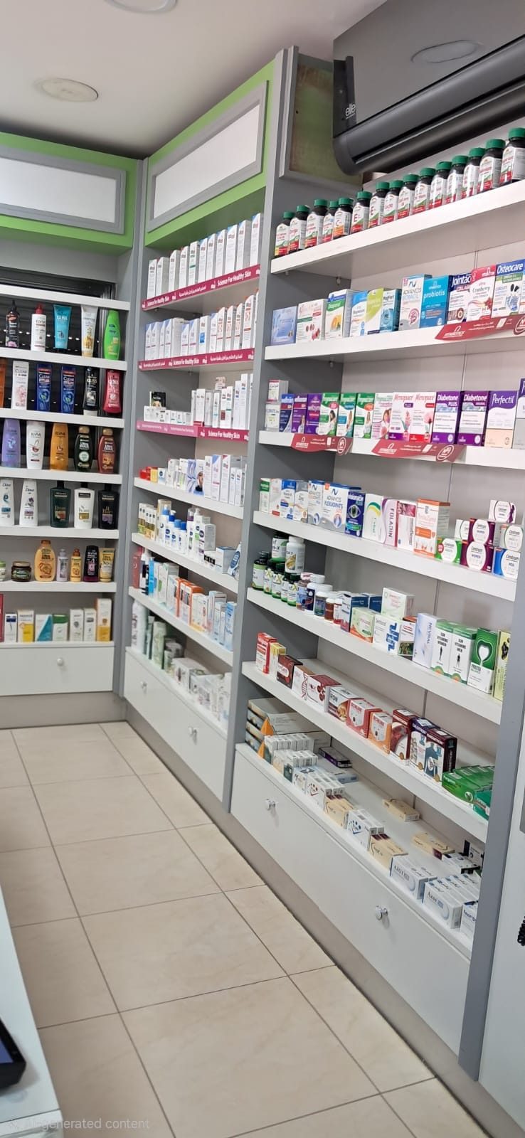 Aisle view of the pharmacy with haircare and skincare shelving on the left and supplements and medicines on the right